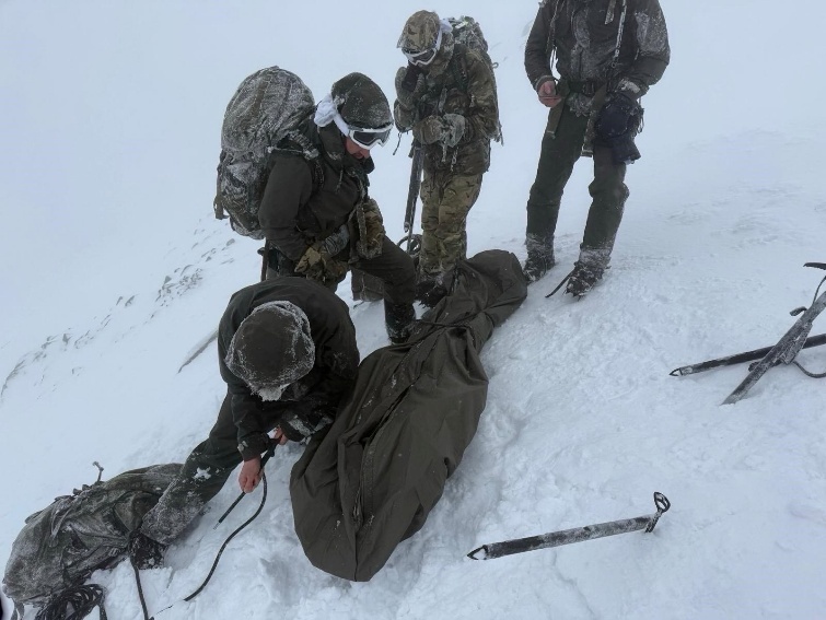 Marines on top of Ben Nevis in terrible conditions rescuing stranded climber