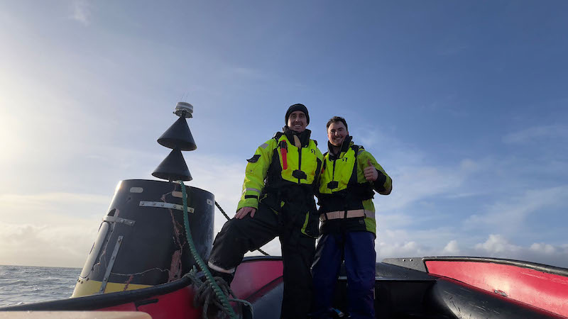 Craig Johnstone (l) and senior marine operative Bryce Harvey (r) after they had successfully installed the new lights