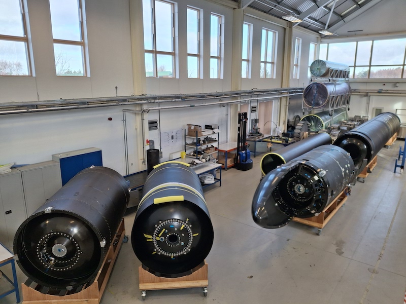 integrated second stage and fairing structures, with two other second-stage tank assemblies to the left