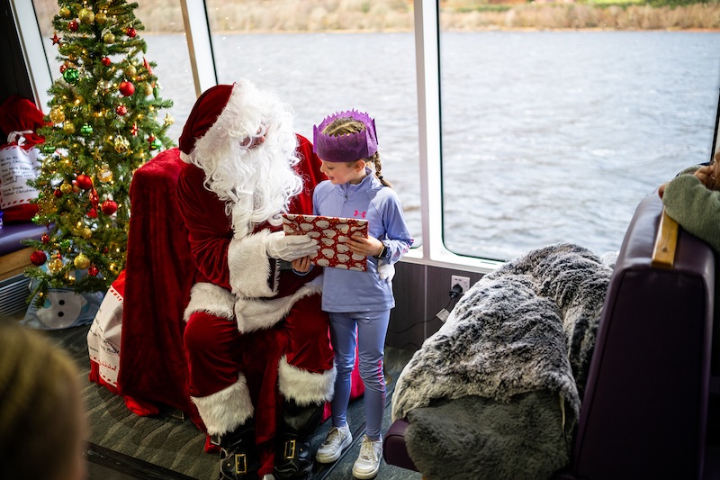 Santa meeting children at Santa Cruise, Jacobite Loch Ness Cruises